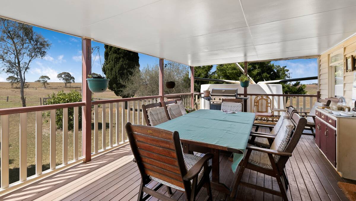 The fully screened deck area is a feature of the Denville homestead.