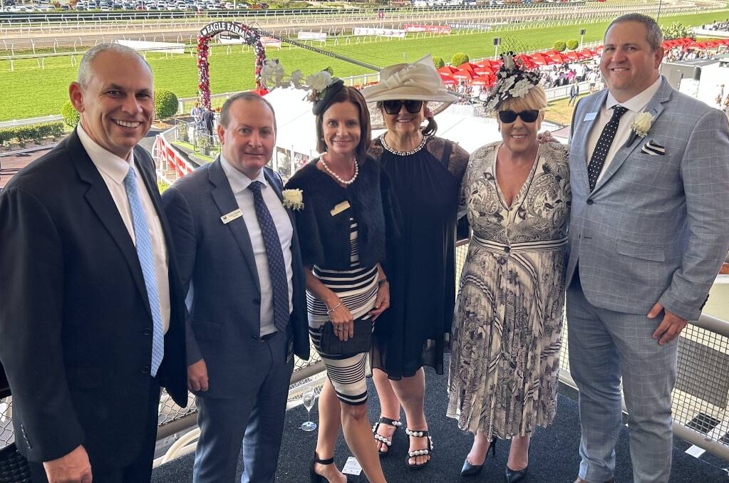 Hancock Agriculture CEO Adam Giles, Droughtmaster Australia CEO and Brisbane Racing Club director Simon Gleeson, Naomi Heyman, Hancock Agriculture chair Gina Rinehart, Teena McQueen and Droughtmaster Australia president Todd Heyman at the Queensland Derby in Brisbane on Saturday. Mrs Rinehart purchased a BRC corporate box in a charity raffle at the recent Rural Aid Long Lunch. 