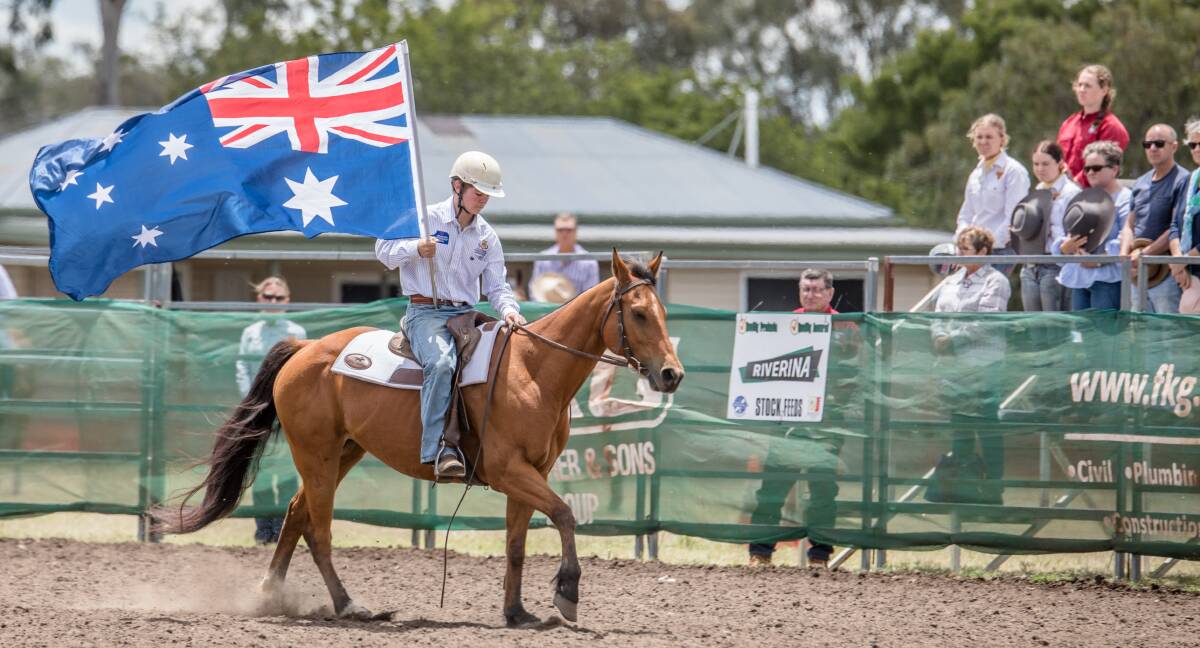 REMEMBERANCE DAY: Flag bearer Darcy Wockner at the High School Percentile Cup Campdraft in Pittsworth.