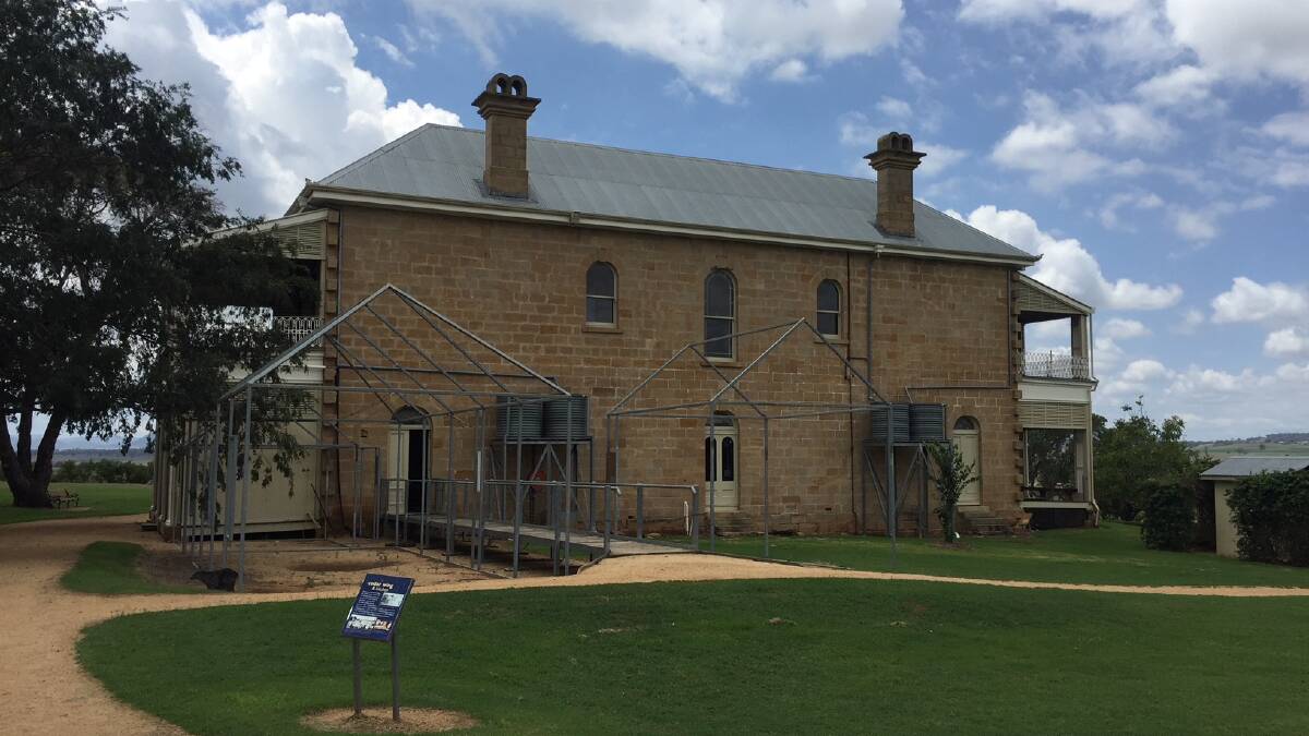 The rear of Glengallan Homestead with metal outlines used to show the kitchen area.