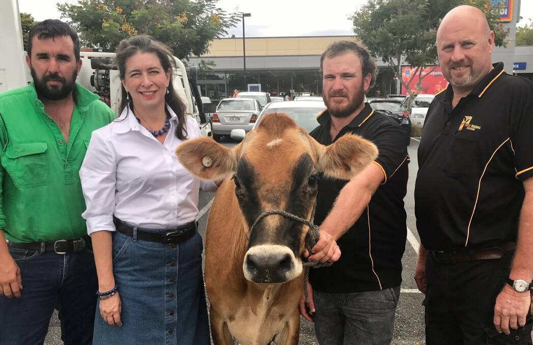Taking the big stock to Coles and Woolworths - Kingaroy dairy farmer Damien, LNP Senator for Queensland, Susan McDonald, and Beaudesert dairy farmers Craig Brook and Brad Teese.