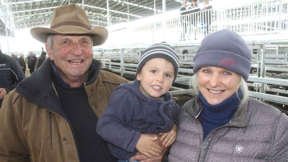 Charles and Cass Kimpton, with grandson Piers, were tinkled pink were the sale of their 121 head of Toora West-blood and bred Angus heifers sold to $1429, averaged $1372.