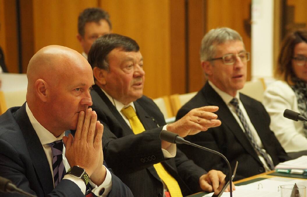 AWI chief executive Stuart McCullough, AWI chairman Wal Merriman and Department of Agriculture secretary Daryl Quinlivan, during Senate Estimates in Canberra. 