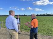 Terragen CEO Jim Cooper and chief scientist Martin Soust discuss dairy cows with leading Purnim Holstein farmer Anthony Eccles.